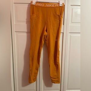 Yellow High Waisted Nike Pro leggings. Size: M